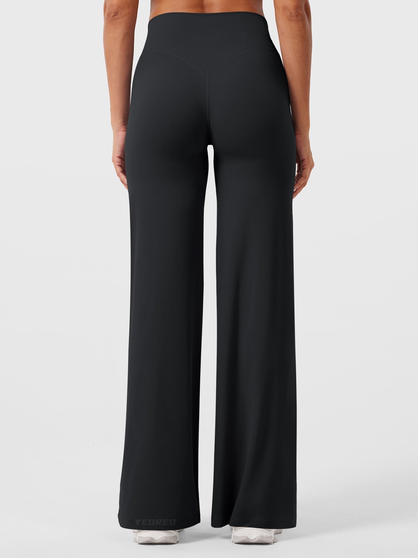 Black women's high waist flared pants from Jesie-London's Millie summer collection, featuring a flattering fit and flowy style.