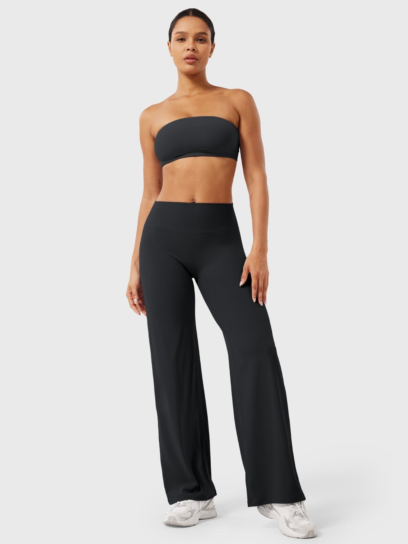 Black women's high waist flared pants from Jesie-London's Millie summer collection, shown on a model with a relaxed fit.