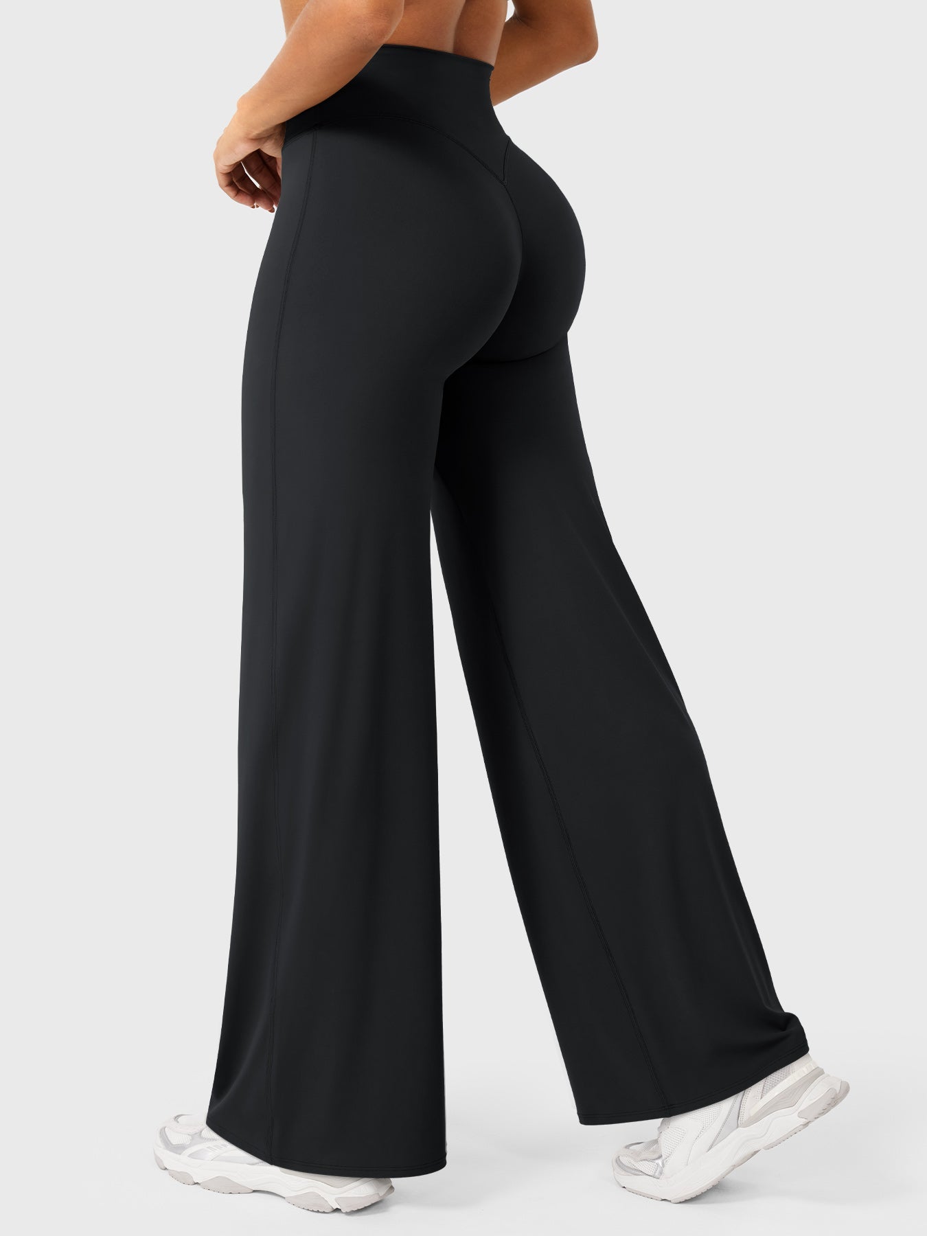 Black women's high waist flared pants from Jesie-London's Millie summer collection, shown on a model.